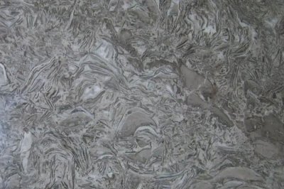 How is artificial stone different from natural stone?